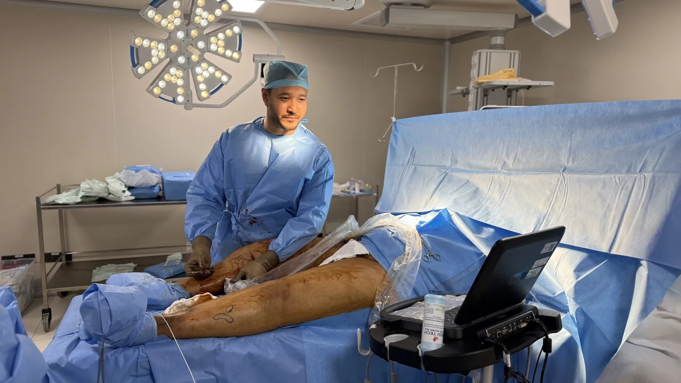 Dr. Sanjit Gogoi performing an ultrasound-guided endovenous laser procedure for varicose veins